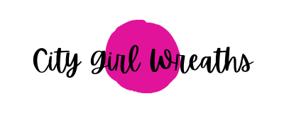pink dot with black text city girl wreath